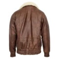 Back view of a brown leather bomber jacket with a soft white shearling collar and elasticized waistband and cuffs, displayed against a white background