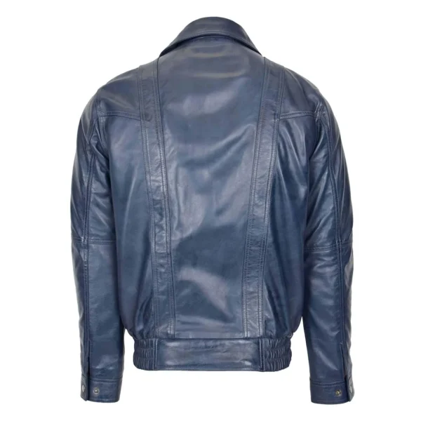 Back view of a blue leather jacket featuring stitched panel details, a classic collar, and adjustable snap button cuffs, displayed against a white background