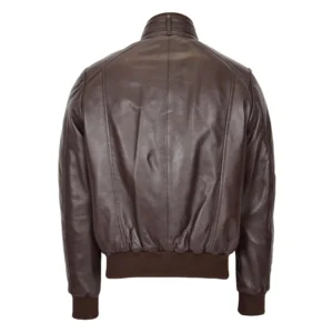 Back view of a brown leather bomber jacket with ribbed waistband and cuffs, featuring a simple design and soft, smooth leather finish, displayed against a white background