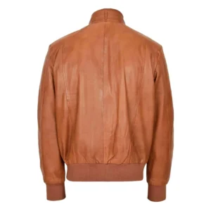 Back view of a tan leather bomber jacket with ribbed waistband and cuffs, featuring a simple design and soft, smooth leather finish, displayed against a white background