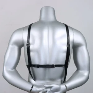 Back view of a mannequin wearing a black leather harness with adjustable straps and metal buckles, designed for a snug and supportive fit