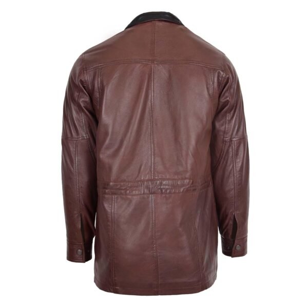 Rear view of a brown leather jacket with black quilted lining, featuring multiple inner pockets with contrasting white trim.