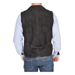 Back view of a model wearing a Men's Suede Button Fastening Waistcoat Devin Black with tan leather belt and dark blue jeans and blue dotted shirt under the vest