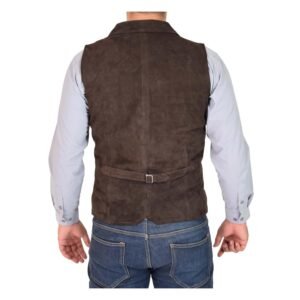 Back view of a model wearing a Men's Suede Button Fastening Waistcoat Devin Brown with tan leather belt and dark blue jeans and blue dotted shirt under the vest