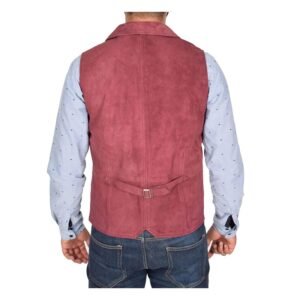 Back view of a model wearing a Men's Suede Button Fastening Waistcoat Devin Burgundy with tan leather belt and dark blue jeans and blue dotted shirt under the vest