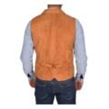 Back view of a model wearing a Men's Suede Button Fastening Waistcoat Devin Tan with tan leather belt and dark blue jeans and blue dotted shirt under the vest