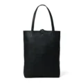 A black leather tote bag, showcasing its sturdy and flat base, against a white background