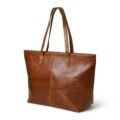 Brown leather tote bag with sturdy handles and a smooth, polished finish, featuring visible stitching and a simple, elegant design with white background