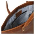 Brown leather tote bag with sturdy handles and a smooth, polished finish, featuring visible stitching and a simple, elegant design close up view