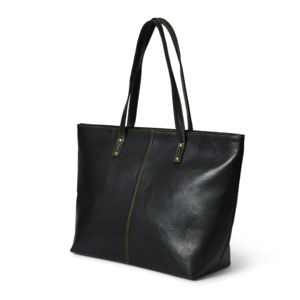 Black leather tote bag with yellow stitching and long handles, displayed against a white background