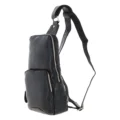Black leather sling backpack with a single adjustable strap, compact design, and multiple zippered compartments for easy organization