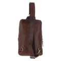 Brown leather sling backpack with a single adjustable strap, compact design, and multiple zippered compartments for easy organization rear view