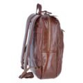 Side view of a brown leather backpack with zippered compartments, a top handle, and padded shoulder straps, highlighting its spacious and practical design side view