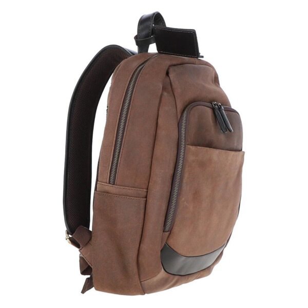 Side view of a brown canvas and leather backpack featuring multiple zippered pockets, a reinforced bottom, and a sturdy leather top handle for durability