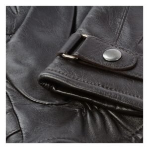 Close-up of Dark brown leather gloves with a ribbed knit cuff in a beige tone, featuring a stylish strap and snap button detail at the wrist for a secure fit and added warmth